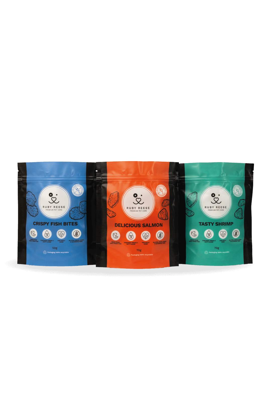 Three standing pouches RUBY REESE TASTY SHRIMP in turquoise, DELICIOUS SALMON in orange and CRISPY FISH BITES in blue