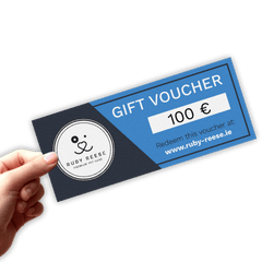 A hand is holding a 100 Euro RUBY REESE gift voucher